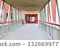 Modern Covered Walkway with Red Double Doors and Bicycle Modern Covered Walkway with Red Double Doors and Bicycle 132669977