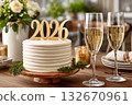 Celebrating 2026 new year's eve with cake and champagne 132670961