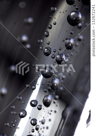 Close up of abstract floating bubbles water droplets condensation rain on a glass transparent bokeh background Close up of abstract floating bubbles water droplets condensation rain on a glass transparent bokeh background 132672241