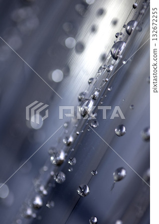 Close up of abstract floating bubbles water droplets condensation rain on a glass transparent bokeh background Close up of abstract floating bubbles water droplets condensation rain on a glass transparent bokeh background 132672255