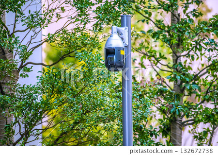 Yokohama cityscape in Japan - Security cameras on street corners. Security cameras in front of Kannai Station from the sidewalk, and at Base Gate Yokohama Kannai Tower. 132672738