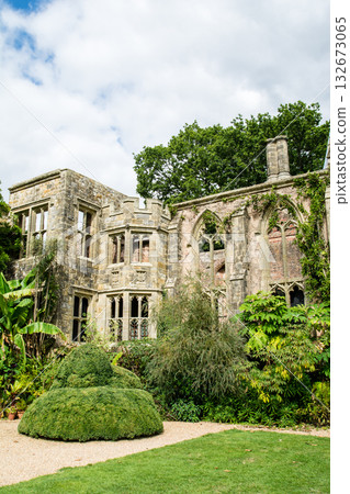 A historic stone building with only its walls remaining under a bright sky with white clouds in Nyman Park, a suburb of London 132673065