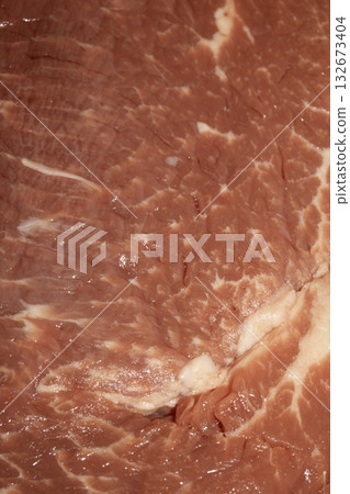 Close up of raw meat steak cut beef on a white background Close up of raw meat steak cut beef on a white background 132673404