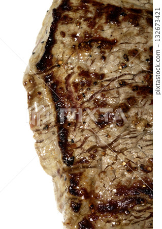 Close up of a cooked grilled steak slice on white background 132673421