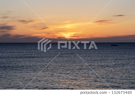 Orange dawn on the winter sea 132673480