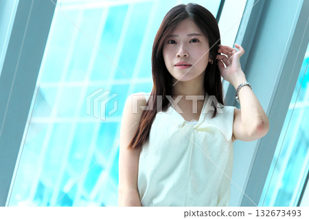 Portrait of a career woman with a bright expression in an urban office 132673493
