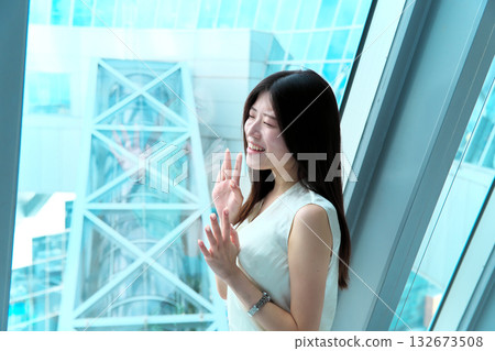Portrait of a career woman with a bright expression in an urban office Portrait of a career woman with a bright expression in an urban office 132673508
