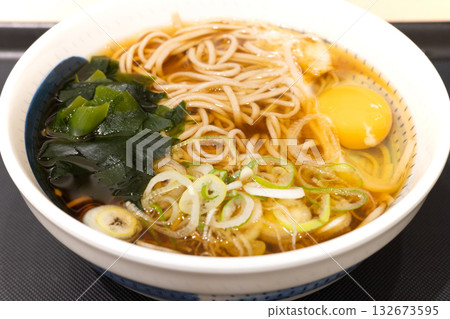 Delicious Tsukimi Soba at a Standing Soba Restaurant Delicious Tsukimi Soba at a Standing Soba Restaurant 132673595
