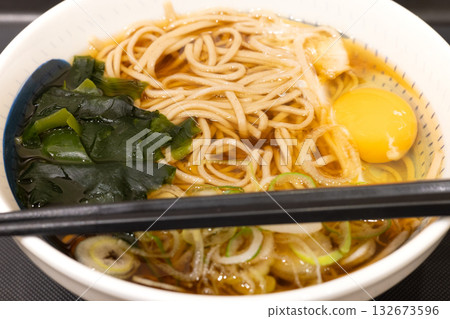 Delicious Tsukimi Soba at a Standing Soba Restaurant Delicious Tsukimi Soba at a Standing Soba Restaurant 132673596