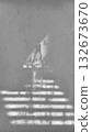 Minimalist Black and White Still Life of an Empty Glass Bottle with Abstract Sunlight and Shadow Lines 132673670
