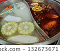 Chinese Hot Pot with Spicy Mala and Clear Soup Base, with Corn and Vegetables 132673671
