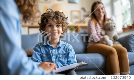 Child boy at session in psychologist's office. Psychologist trying to understand upset child, support him and help cope with problems. Mental health concept 132673940