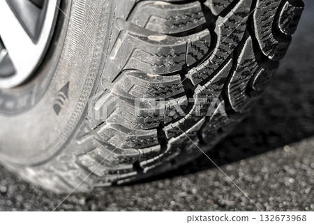 Wheel with winter tyre on the asphalt close up 132673968