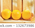 Wooden box with grapefruits 132673986