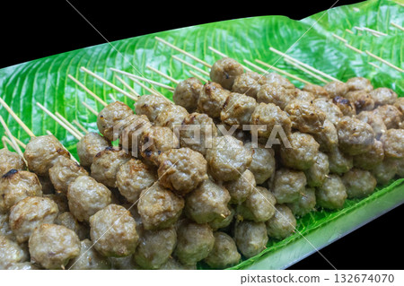 Top view of meat ball on banana leaf on black isolated, focus selective 132674070