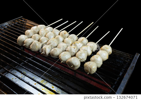 Top view of meat ball Skewer on black isolated, focus selective Top view of meat ball Skewer on black isolated, focus selective 132674071