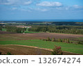 A vast farmland overlooking the sea 132674274