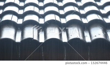hard rain falling on tile rooftop at home and dropping to ground hard rain falling on tile rooftop at home and dropping to ground 132674446