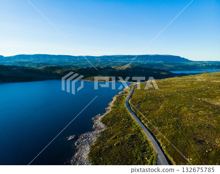 Road crossing Hardangervidda plateau, Norway. Aerial view. 132675785