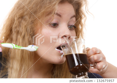 Funny woman being late drinking coffee Funny woman being late drinking coffee 132675957