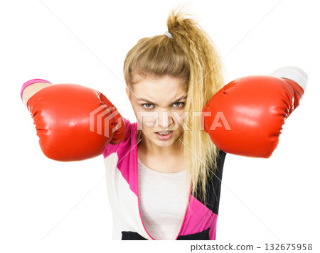 Angry woman wearing boxing gloves 132675958