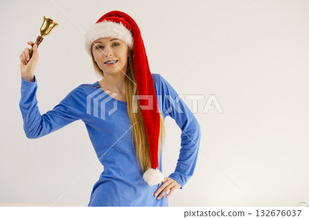 Christmas woman holding bell. Christmas woman holding bell. 132676037