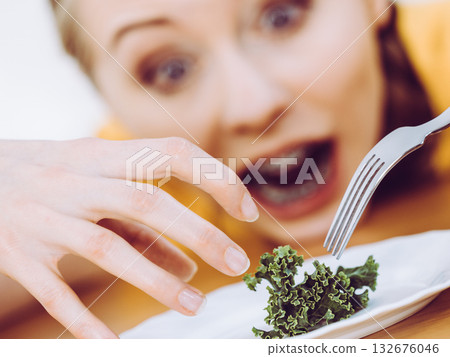 Shocked young woman being on diet Shocked young woman being on diet 132676046