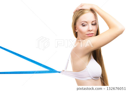 Woman wearing too big bra, loose band Woman wearing too big bra, loose band 132676051