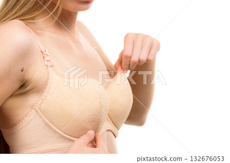 Woman wearing too big bra 132676053