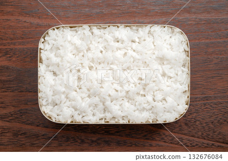 White rice packed in an anodized aluminum lunch box 132676084