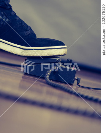 Man using guitar effects pedal 132676130