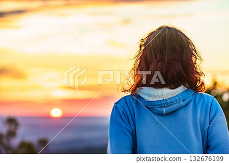 Woman enjoying sunset view. Woman enjoying sunset view. 132676199