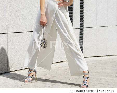 Woman wearing high heels and culottes Woman wearing high heels and culottes 132676249
