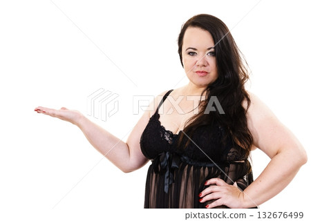 Woman plus size in lingerie holds open hand 132676499