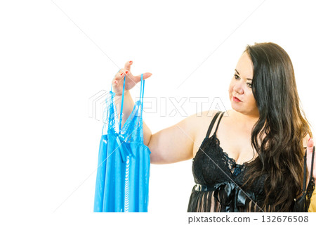 Plus size woman fitting satin nightwear 132676508