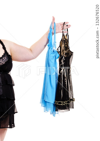 Mature woman choosing sating nightwear Mature woman choosing sating nightwear 132676520