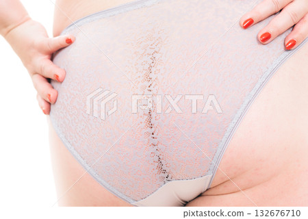 Plus size woman in lingerie back view. 132676710
