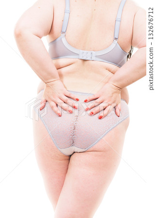 Plus size woman in lingerie back view. 132676712