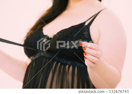 Woman in black lingerie showing her breast chest. Woman in black lingerie showing her breast chest. 132676743