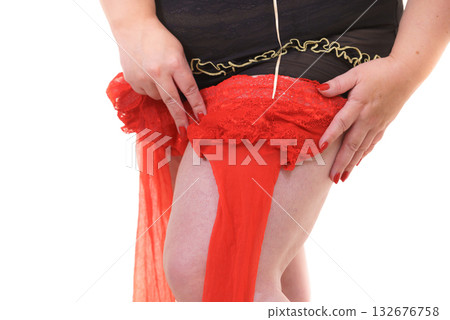 Woman plus size puts on red nylon stockings Woman plus size puts on red nylon stockings 132676758