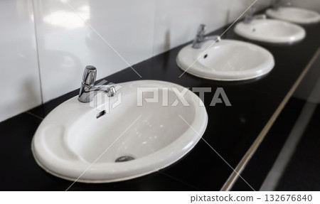 Top view of chrome faucet wash basin. sink on countertop in bathroom. Top view of chrome faucet wash basin. sink on countertop in bathroom. 132676840