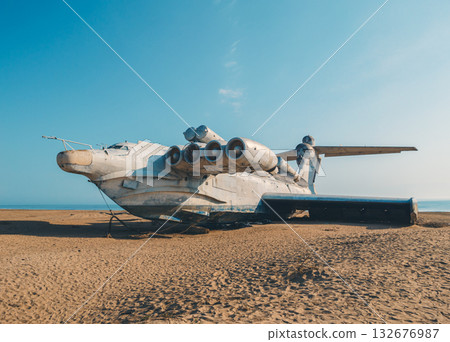 Forgotten Lun-class ekranoplan rests on a sandy beach along the Caspian Sea in Dagestan, Russia Forgotten Lun-class ekranoplan rests on a sandy beach along the Caspian Sea in Dagestan, Russia 132676987
