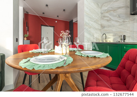 Modern Dining Area with Red Chairs and Wooden Table Modern Dining Area with Red Chairs and Wooden Table 132677544