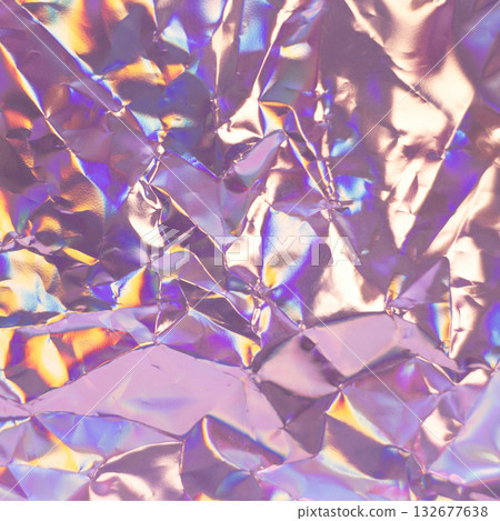Iridescent crumpled foil texture in pink, purple, and gold hues for design and background use 132677638