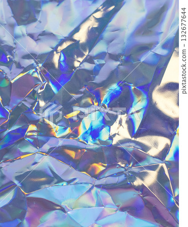 Iridescent crumpled foil texture with rainbow reflections for abstract, futuristic design Iridescent crumpled foil texture with rainbow reflections for abstract, futuristic design 132677644