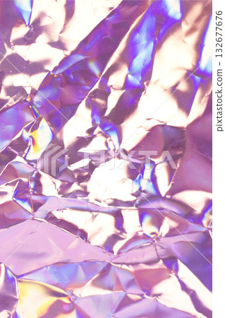 Iridescent crumpled foil texture with purple, pink and blue hues and rainbow reflections 132677676
