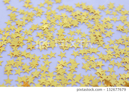 Yellow Star Confetti Scattered on Purple Background for Festive Party Decor Yellow Star Confetti Scattered on Purple Background for Festive Party Decor 132677679