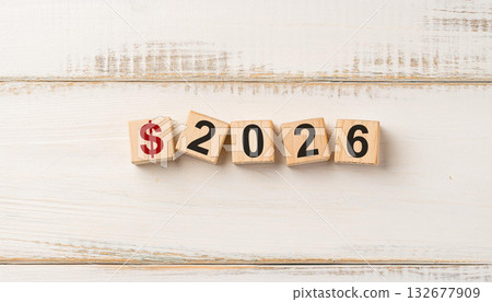Red Dollar Sign and Wooden Blocks Spelling 2026 on White Rustic Background for Finance and Budget Planning 132677909