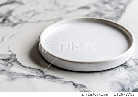Simple white ceramic plate on marble surface 132678795
