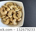 Close-up of dried cashews in a white bowl. Healthy, natural food. 132679233